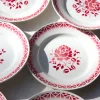 8 assiettes plates à la fleur rouge