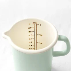 Pichet mesureur en émail pastel