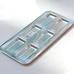 Plaque à financiers en fer