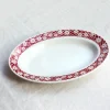 Plat ovale au bandeau rouge fleuri