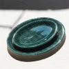 Plats ovales en faïence vert foncé